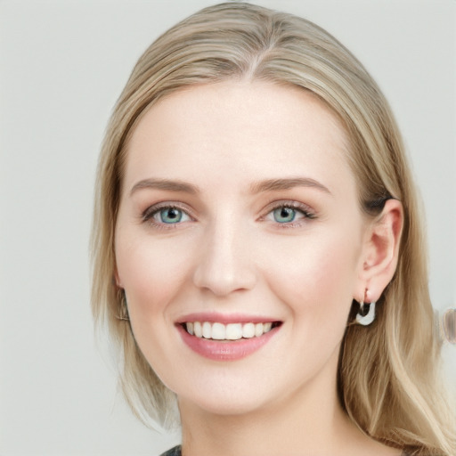 Joyful white young-adult female with long  brown hair and blue eyes