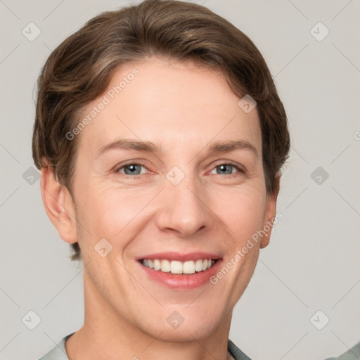 Joyful white adult female with short  brown hair and grey eyes