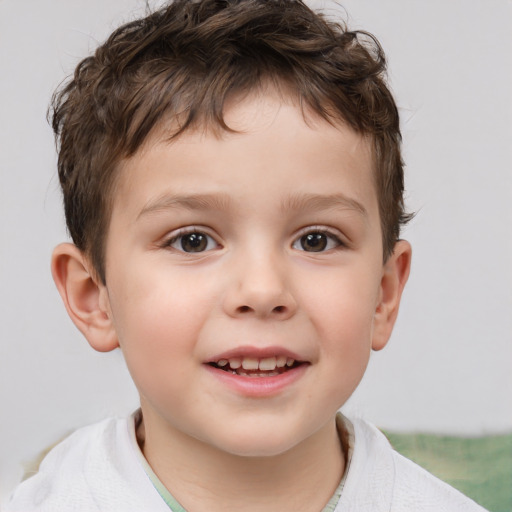 Joyful white child male with short  brown hair and brown eyes