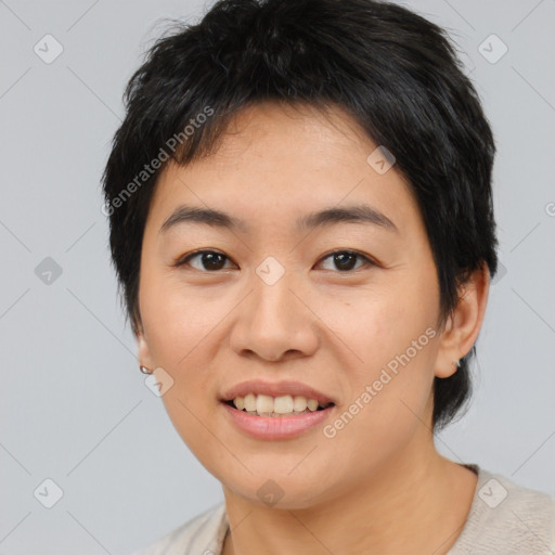 Joyful asian young-adult female with medium  black hair and brown eyes