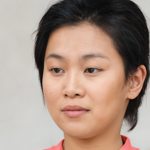 Neutral asian young-adult female with medium  brown hair and brown eyes