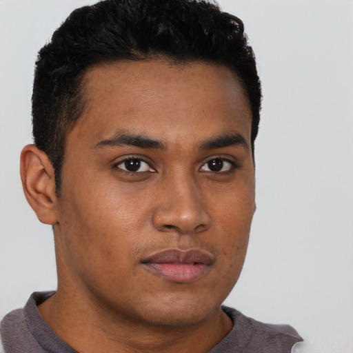 Neutral latino young-adult male with short  brown hair and brown eyes
