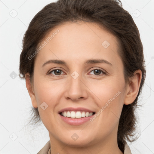 Joyful white young-adult female with medium  brown hair and grey eyes