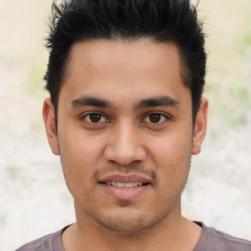 Joyful asian young-adult male with short  black hair and brown eyes