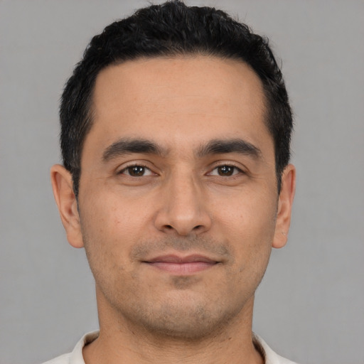 Neutral latino young-adult male with short  black hair and brown eyes