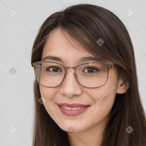 Joyful white adult female with long  brown hair and brown eyes