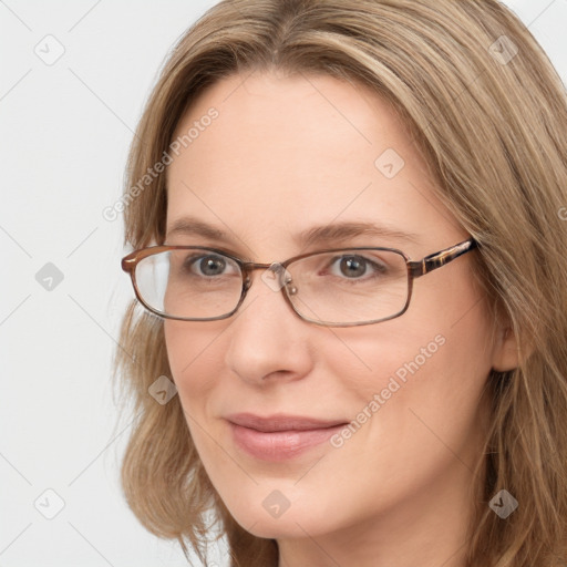 Joyful white young-adult female with long  brown hair and blue eyes