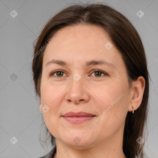 Joyful white adult female with medium  brown hair and brown eyes