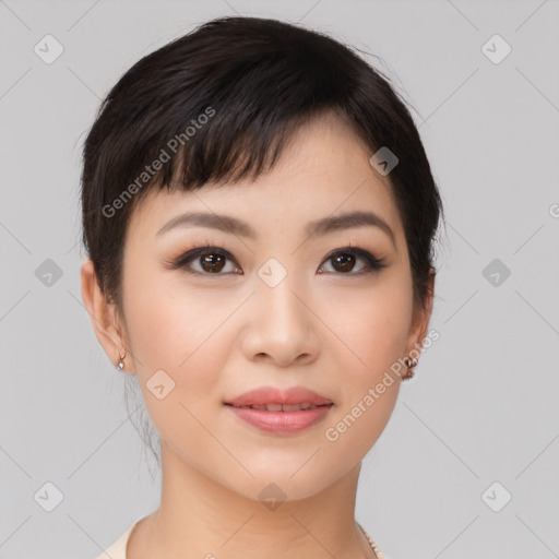 Joyful asian young-adult female with short  brown hair and brown eyes