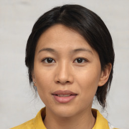 Joyful asian young-adult female with medium  brown hair and brown eyes