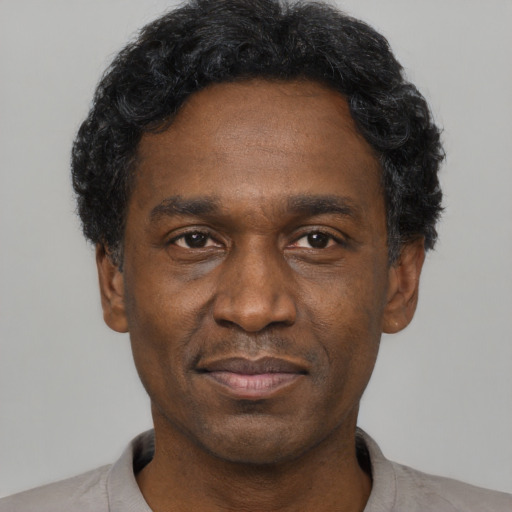 Neutral black adult male with short  black hair and brown eyes