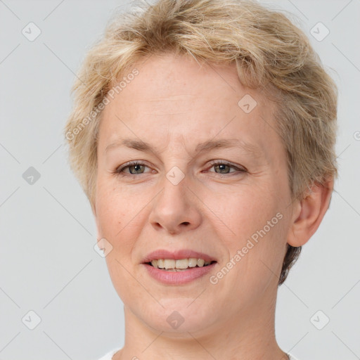 Joyful white adult female with short  brown hair and brown eyes