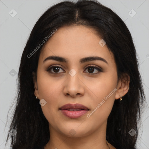 Joyful latino young-adult female with long  black hair and brown eyes