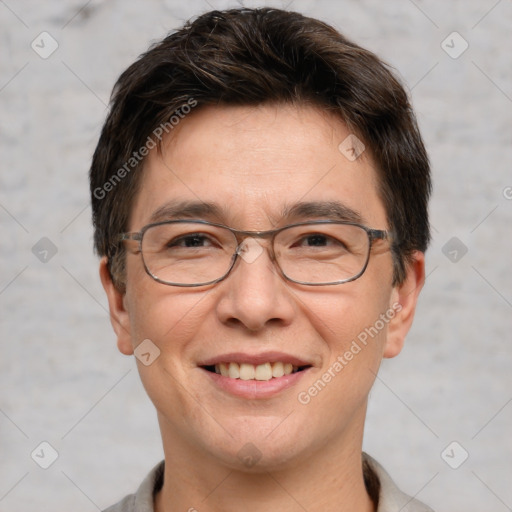 Joyful white adult male with short  brown hair and grey eyes