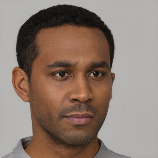 Neutral black young-adult male with short  black hair and brown eyes