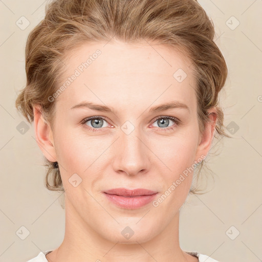 Joyful white young-adult female with medium  brown hair and blue eyes