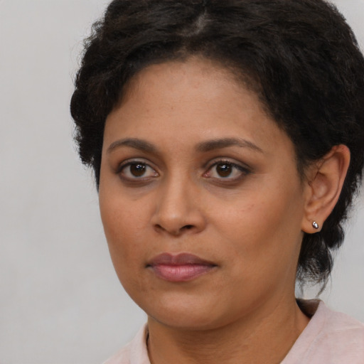 Neutral black young-adult female with short  brown hair and brown eyes