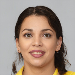 Joyful white young-adult female with medium  brown hair and brown eyes