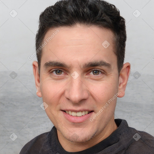 Joyful white adult male with short  brown hair and brown eyes