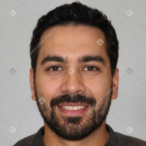 Joyful latino young-adult male with short  black hair and brown eyes