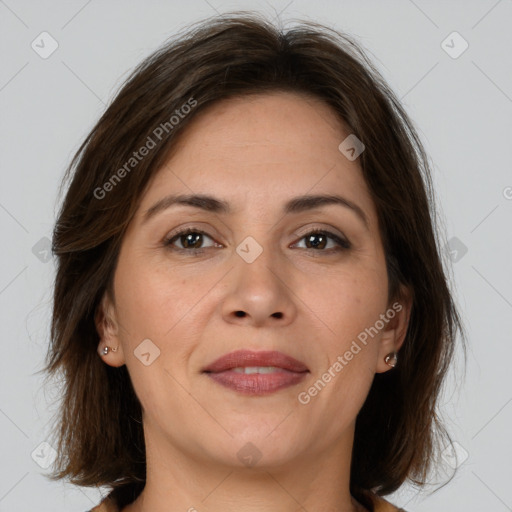 Joyful white adult female with medium  brown hair and brown eyes