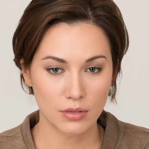 Neutral white young-adult female with medium  brown hair and brown eyes