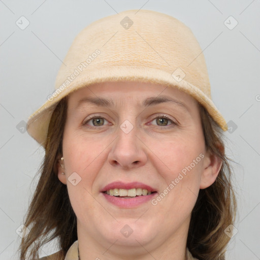 Joyful white adult female with medium  brown hair and grey eyes