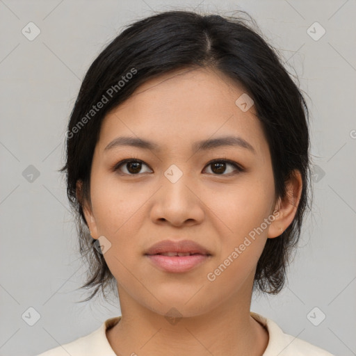 Joyful asian young-adult female with medium  black hair and brown eyes