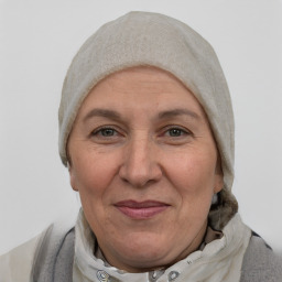 Joyful white middle-aged female with short  brown hair and brown eyes