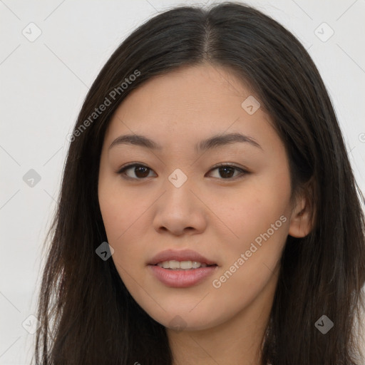 Joyful asian young-adult female with long  brown hair and brown eyes