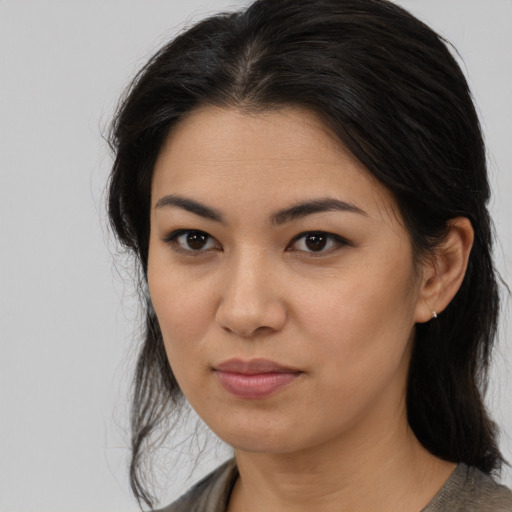 Joyful asian young-adult female with medium  brown hair and brown eyes