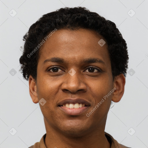 Joyful black young-adult male with short  black hair and brown eyes