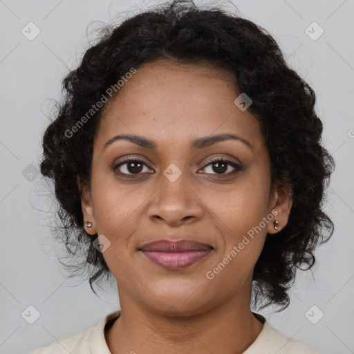 Joyful black adult female with medium  brown hair and brown eyes