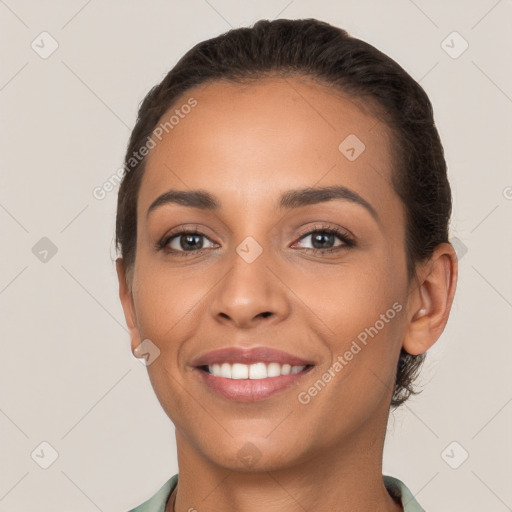 Joyful white young-adult female with short  brown hair and brown eyes