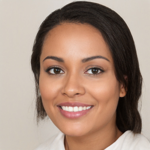 Joyful white young-adult female with medium  black hair and brown eyes