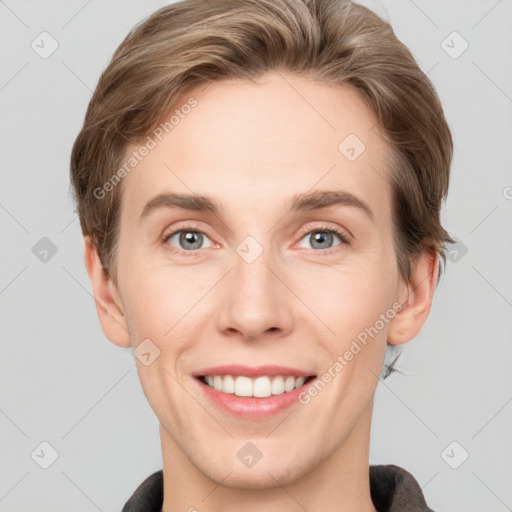 Joyful white young-adult female with short  brown hair and grey eyes