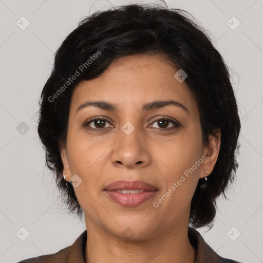 Joyful latino adult female with medium  brown hair and brown eyes