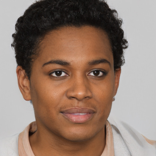 Joyful black young-adult female with short  brown hair and brown eyes