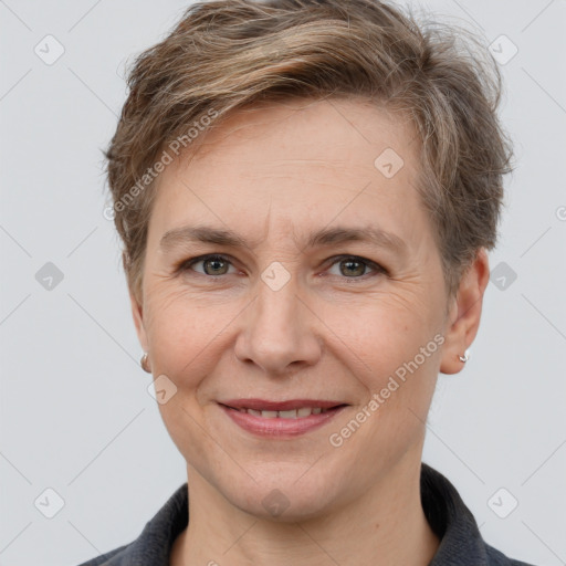 Joyful white adult female with short  brown hair and grey eyes