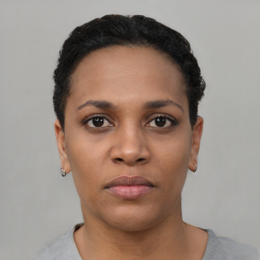 Neutral black young-adult female with short  black hair and brown eyes