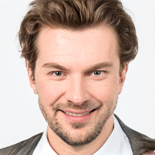 Joyful white adult male with short  brown hair and grey eyes