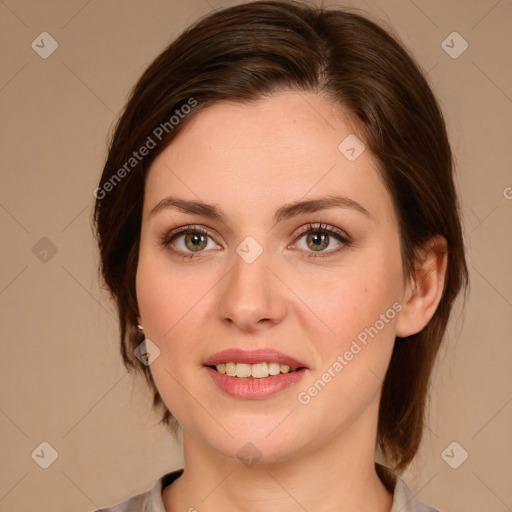 Joyful white young-adult female with medium  brown hair and green eyes