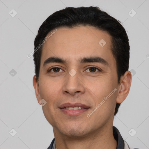 Joyful white young-adult male with short  black hair and brown eyes