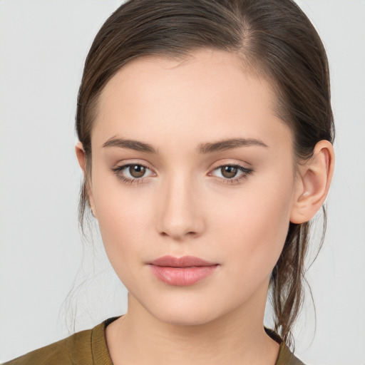 Neutral white young-adult female with medium  brown hair and brown eyes