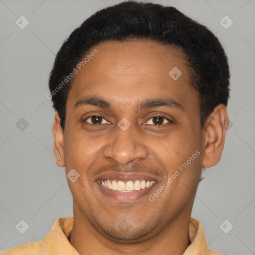 Joyful latino young-adult male with short  brown hair and brown eyes