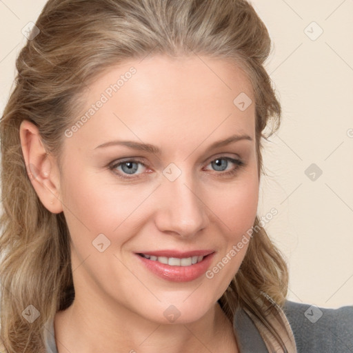 Joyful white young-adult female with long  brown hair and blue eyes