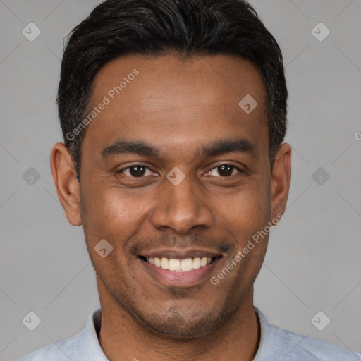 Joyful latino young-adult male with short  black hair and brown eyes