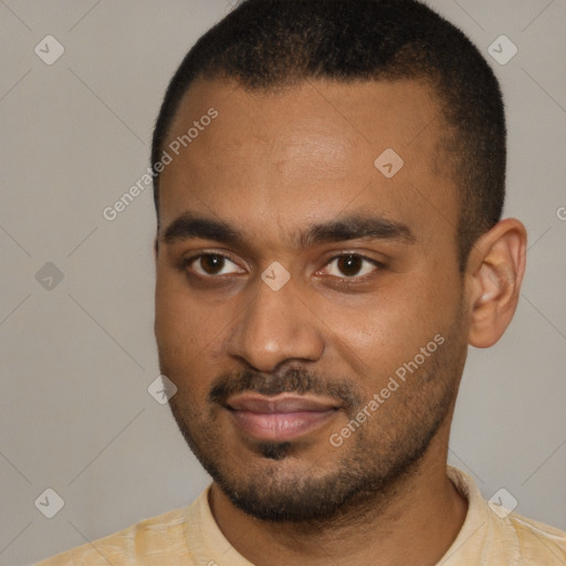 Joyful black young-adult male with short  black hair and brown eyes