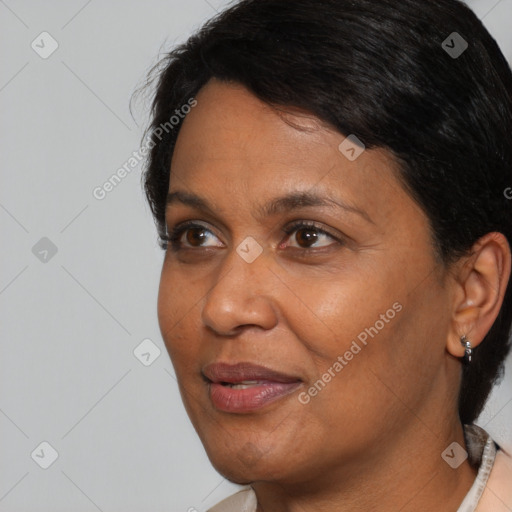 Joyful black adult female with short  brown hair and brown eyes