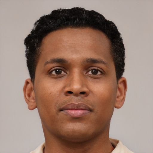 Neutral black young-adult male with short  brown hair and brown eyes